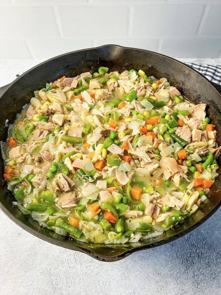 Cooked turkey meat added to the vegetable mixture.