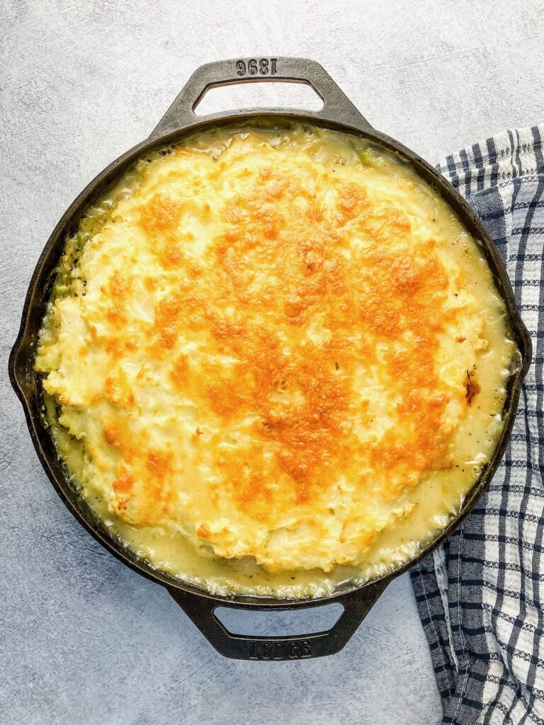 Homemade leftover turkey shepherd's pie baked in a cast iron skillet.