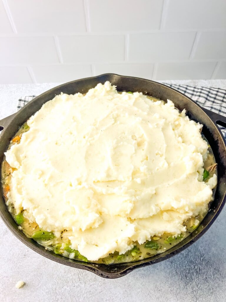 Mashed potatoes spread over top of the turkey shepherd's pie.
