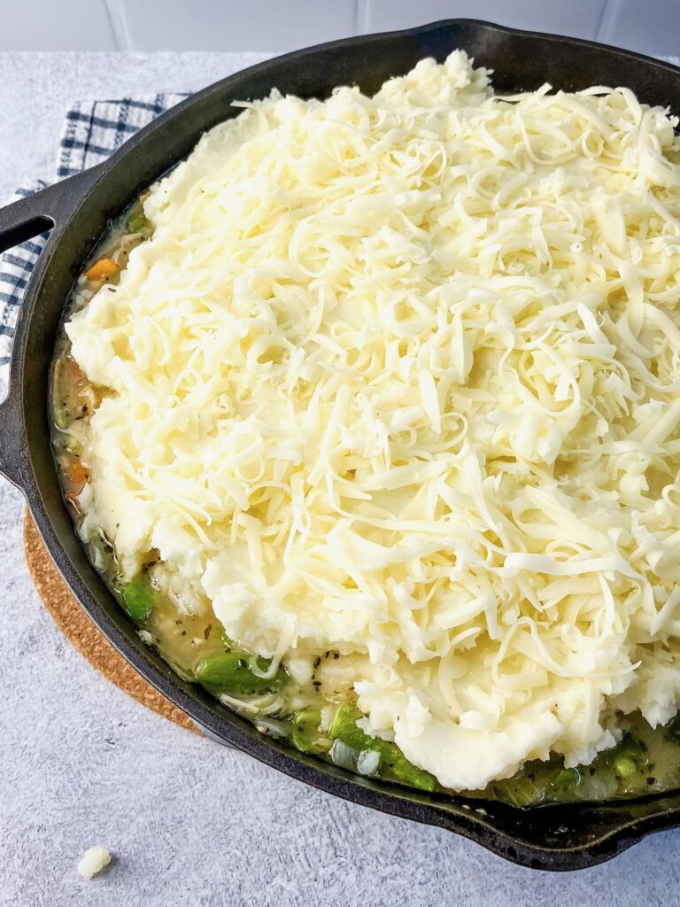 Shredded mozzarella cheese on top of the turkey shepherd's pie.