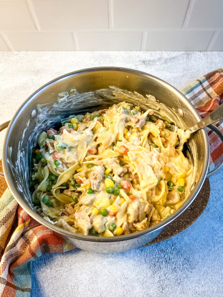 Turkey noodle casserole filling mixed together in a pot.