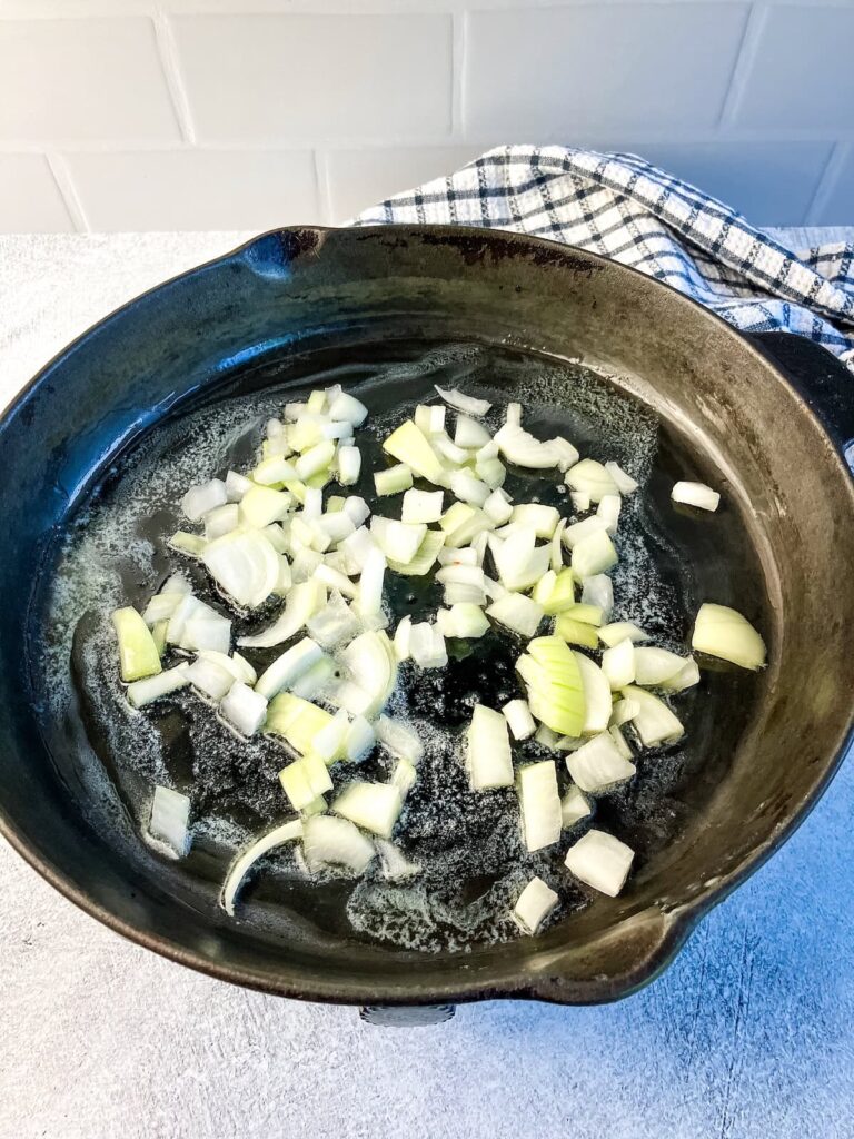 Cooking onions in butter in a cast iron skillet.