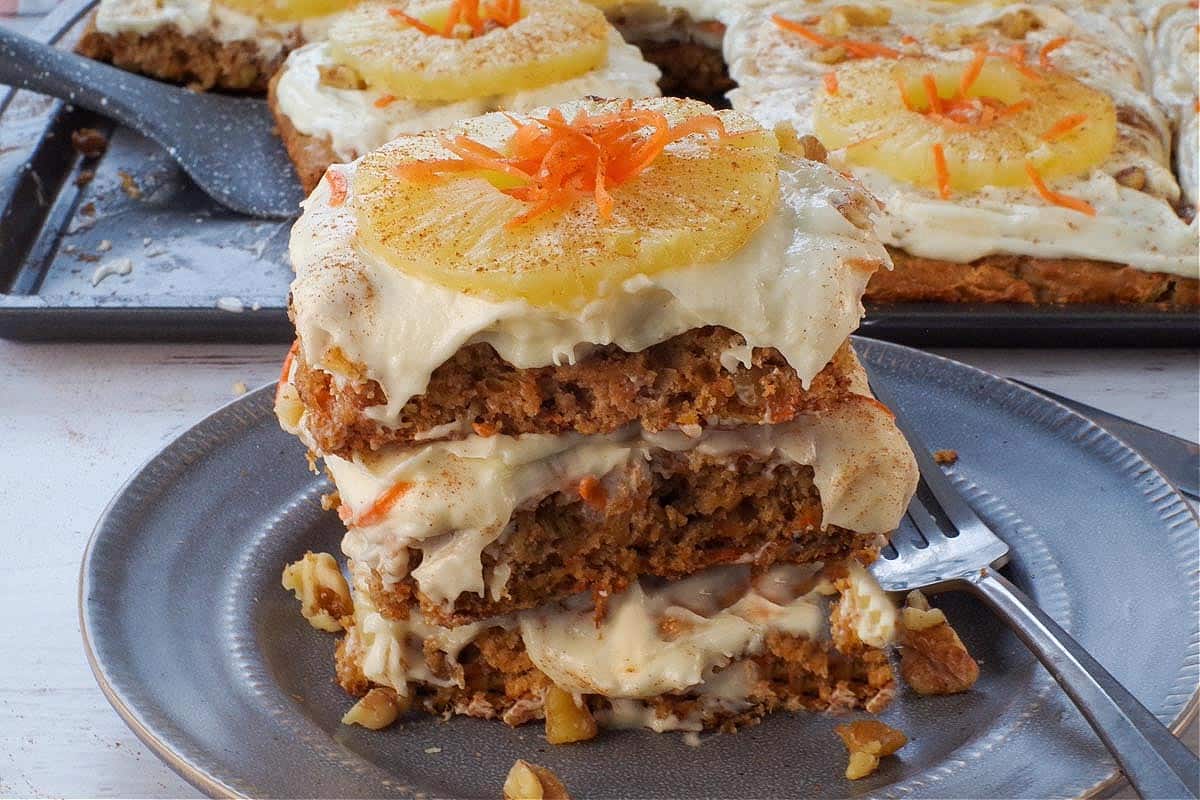 Slices of carrot cake pancakes stacked on a plate.