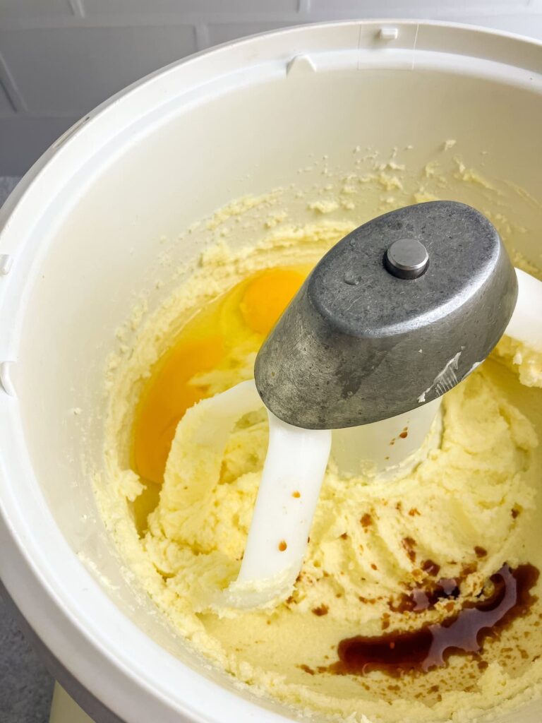 Eggs and vanilla added to the creamed butter mixture.