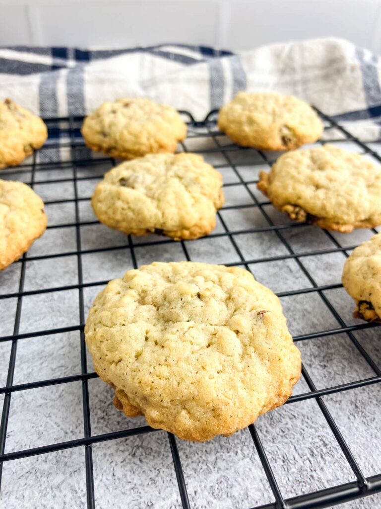 Oatmeal raisin cookies cooling on a wire rack.