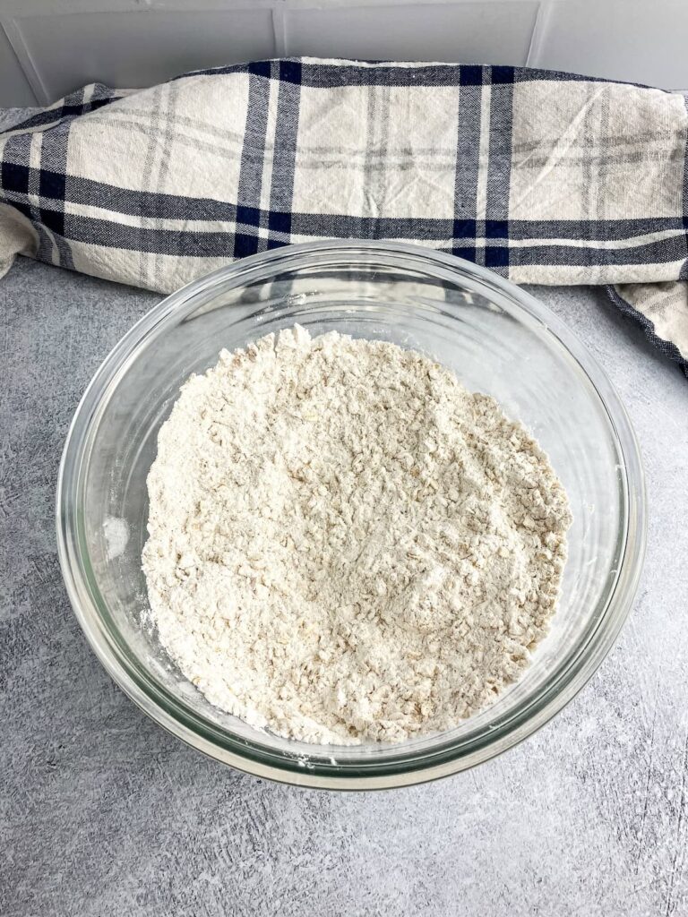 Dry ingredients mixed together in a glass mixing bowl.