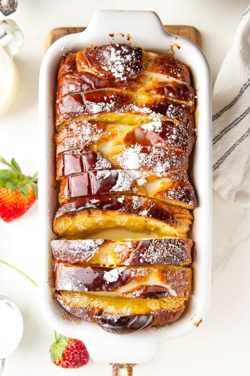 Tres leches French toast bake in a white baking dish.