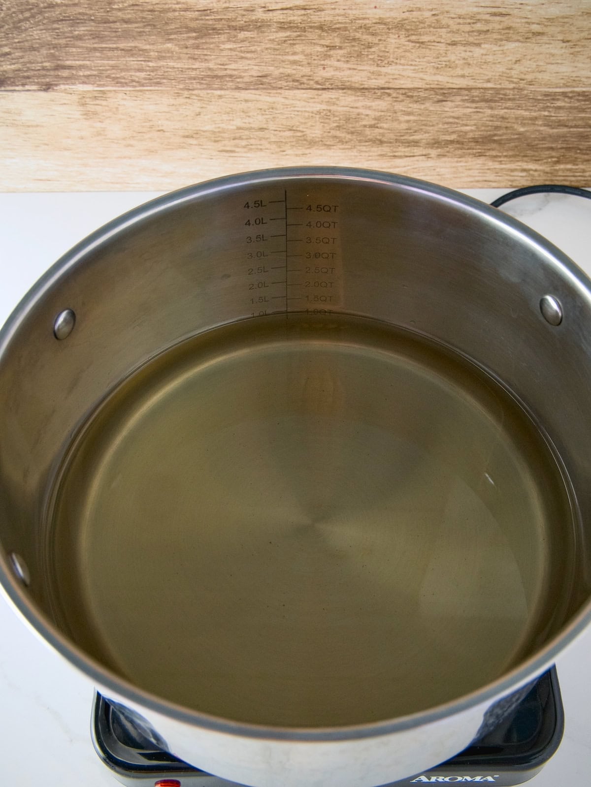 A large pot filled with red clover tea for making jelly.