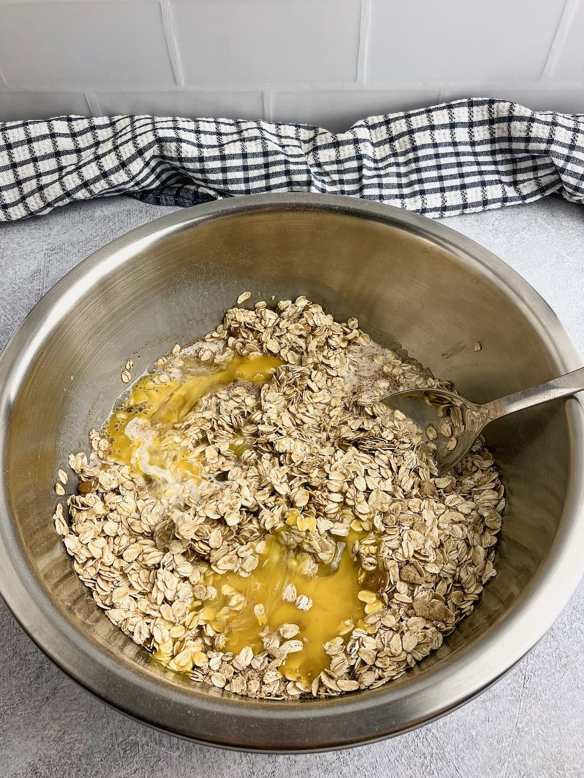 Eggs, milk, vanilla extract, and melted butter are added to the dry ingredients.
