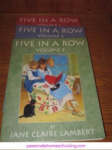 Volumes 1 to 3 of Five in a Row books on a table.