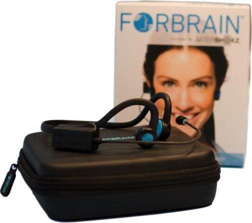 Forebrain headset sitting on top of its case in front of a box.