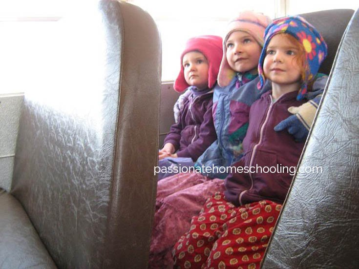 Girls sitting in a bus.