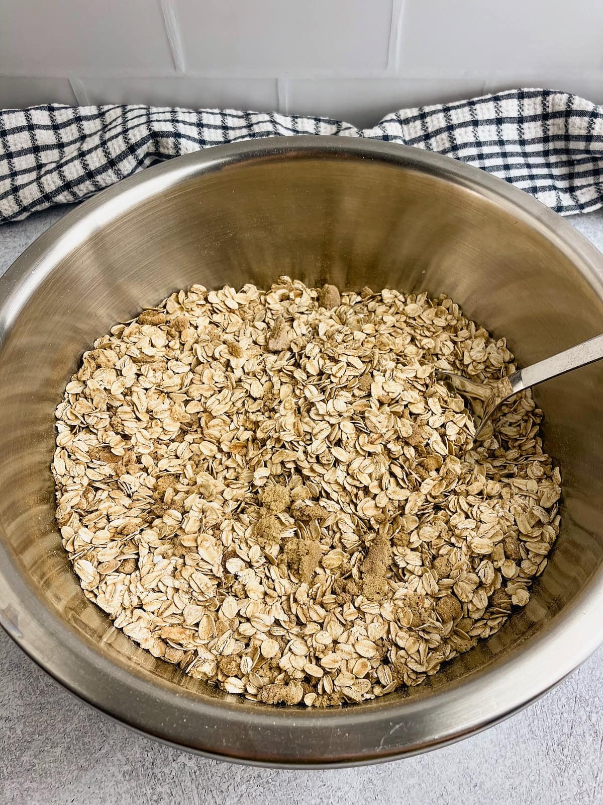 Dry ingredients for strawberry oatmeal bake are mixed together in a large mixing bowl.