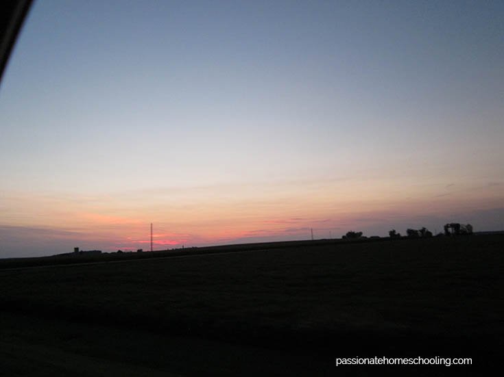 Sunset looking across a field with a pretty pink glow.