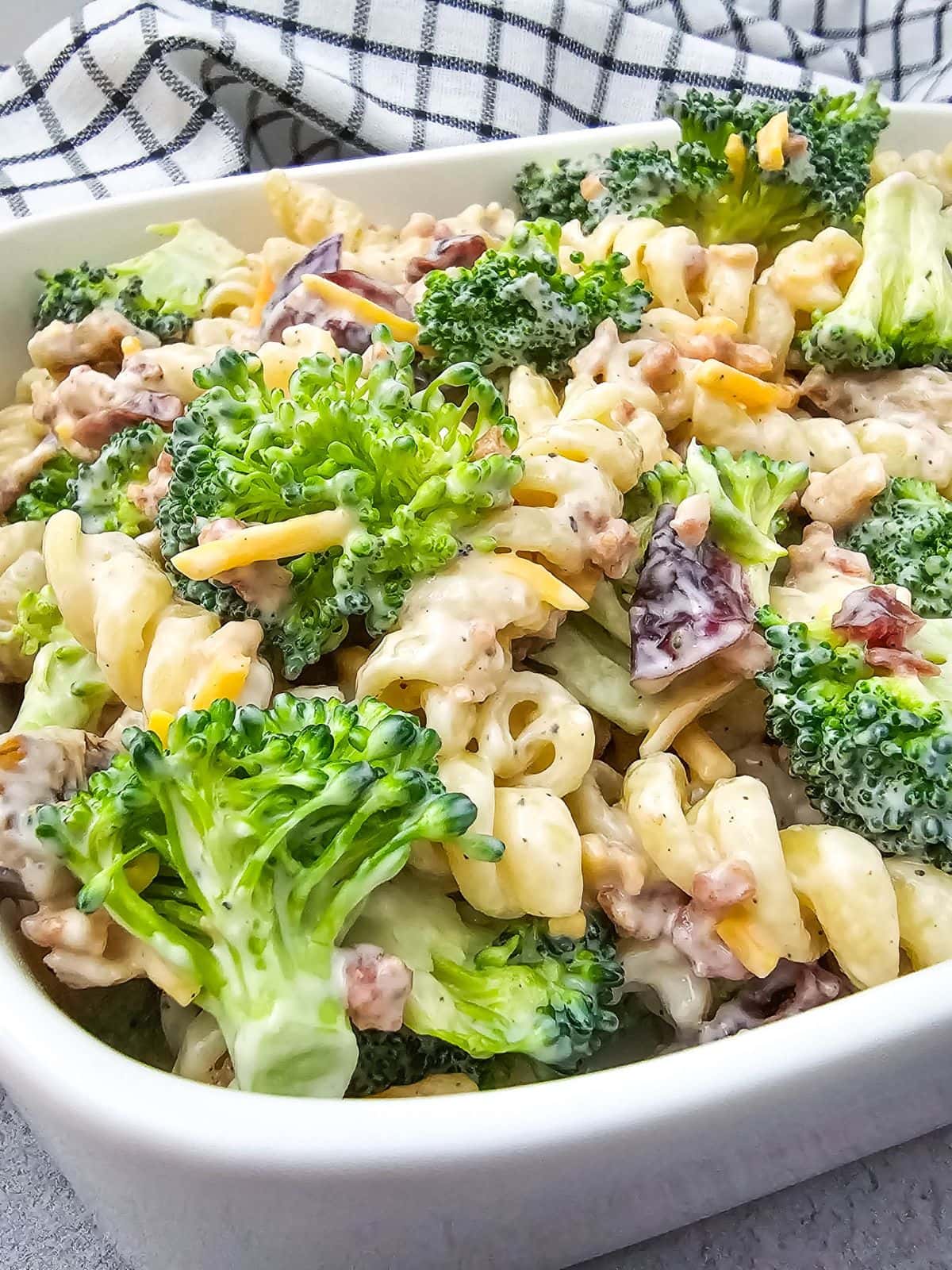 Easy broccoli pasta salad in a white serving dish.