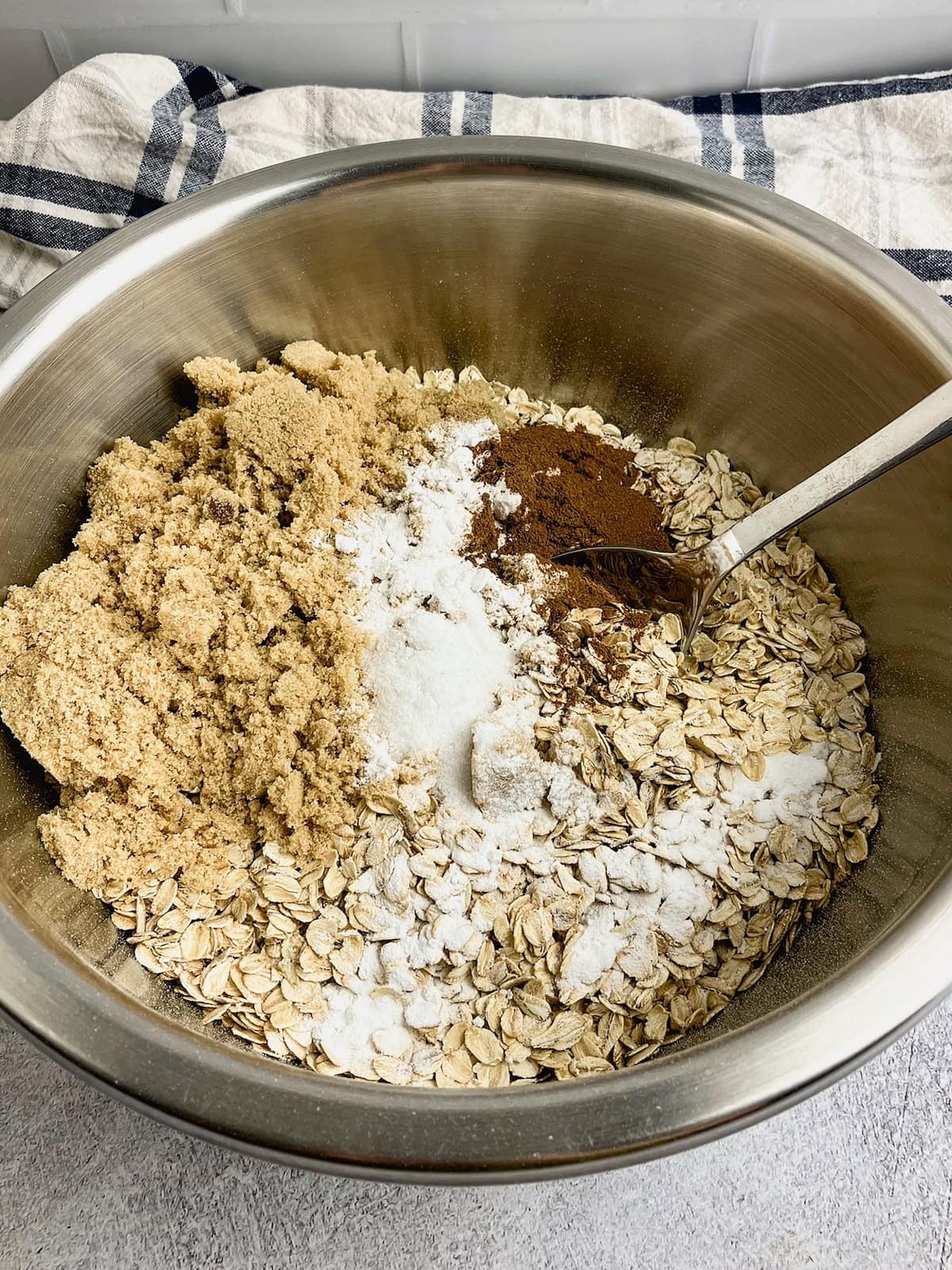 Oats, brown sugar, cinnamon, salt, and baking powder in a large mixing bowl.