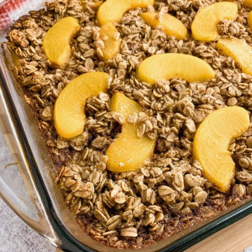 Homemade peach baked oatmeal in a baking dish.