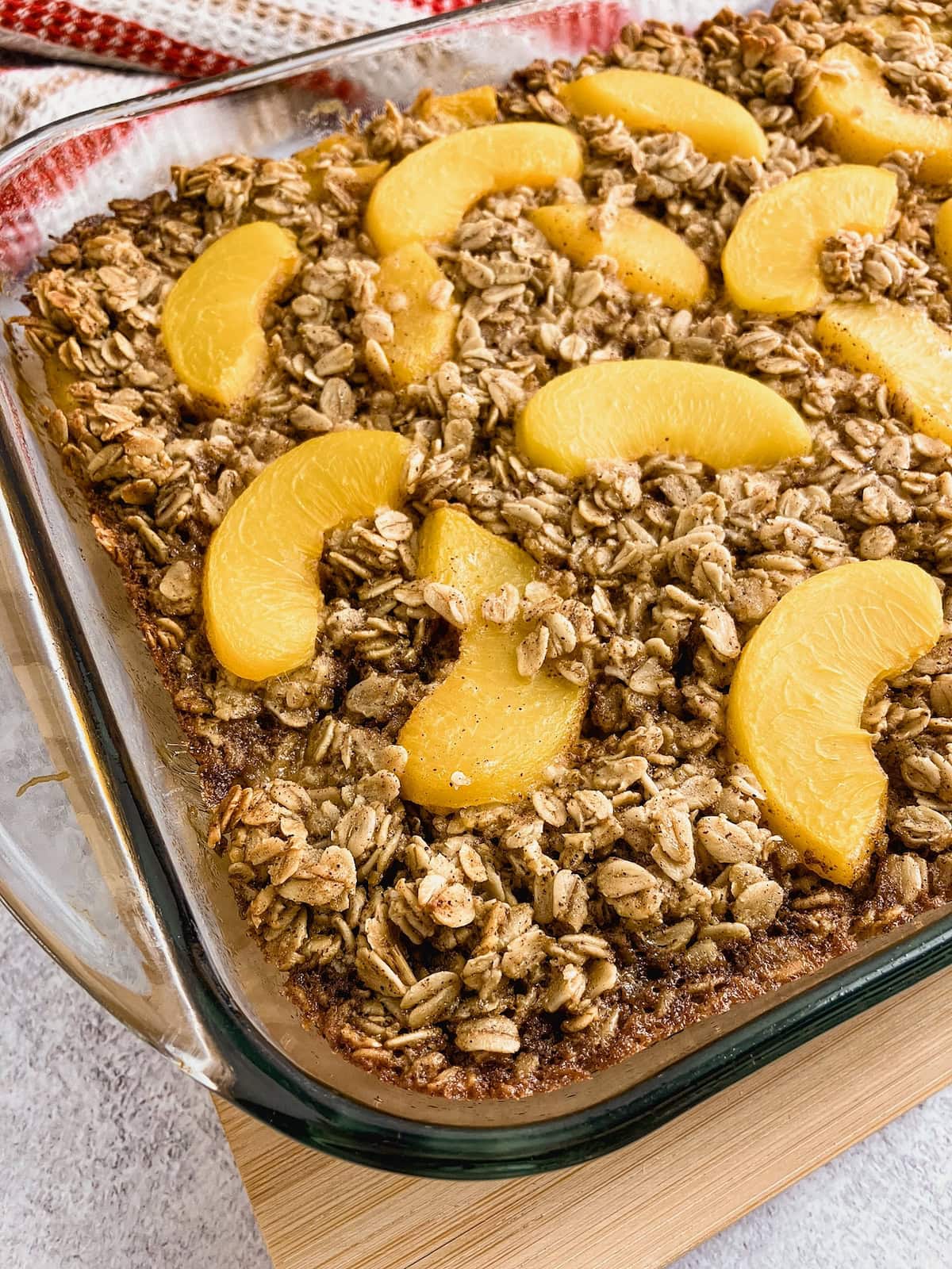 Homemade peach baked oatmeal in a baking dish.