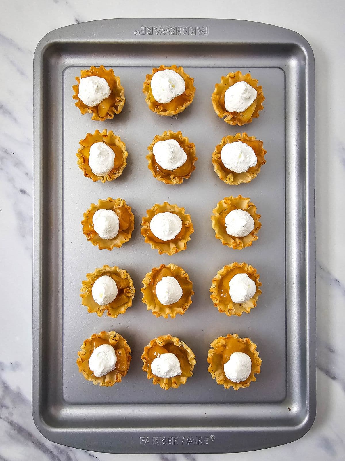 Whipped topping was added on top of the peach pie filling.