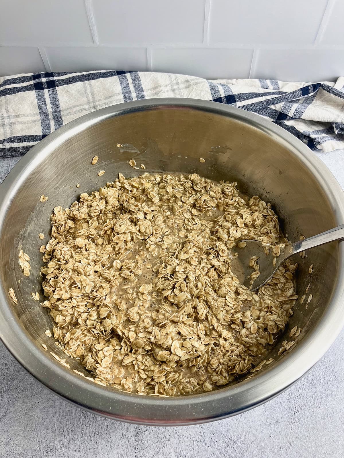 Baked oatmeal batter is stirred together.