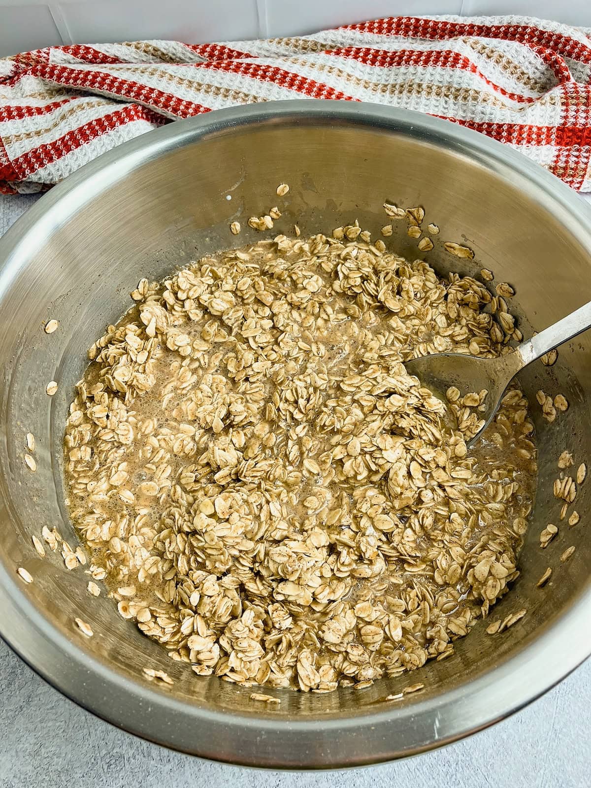 Wet and dry ingredients for baked oatmeal are mixed together.