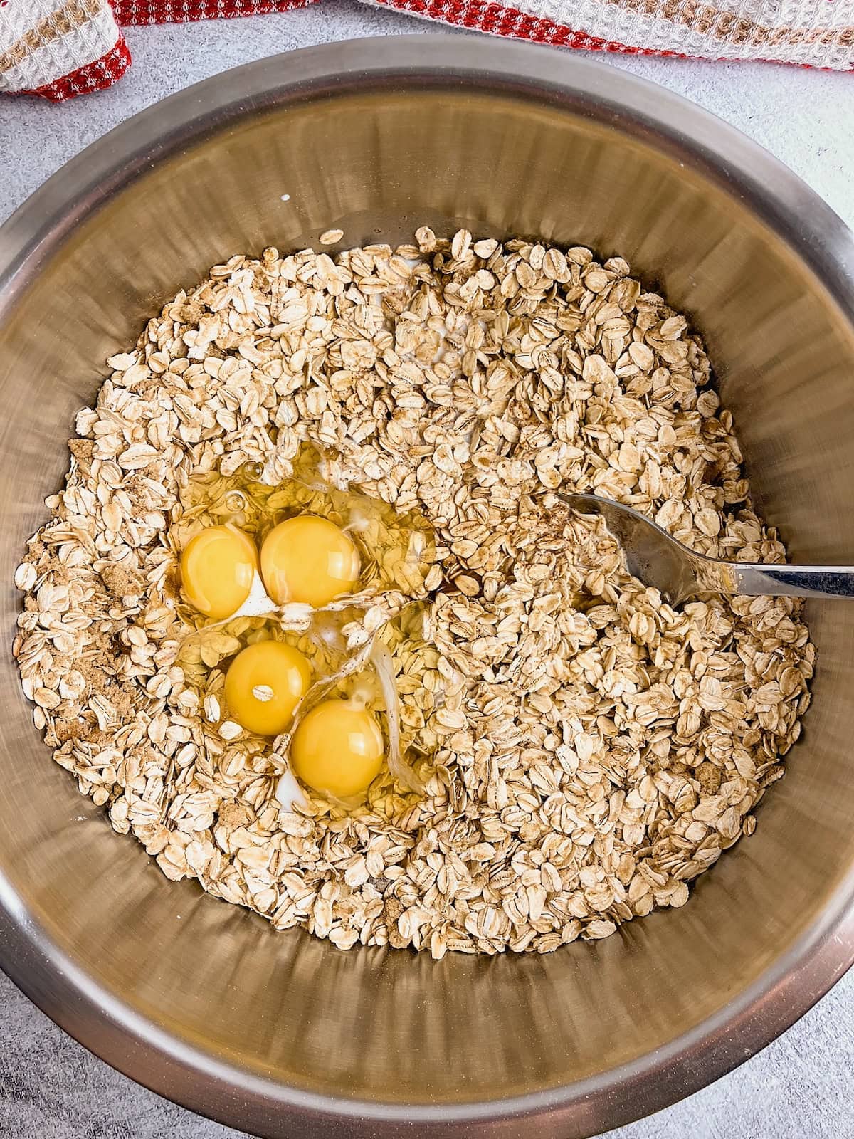 Eggs, milk, vanilla, and melted butter are added to the dry ingredients.