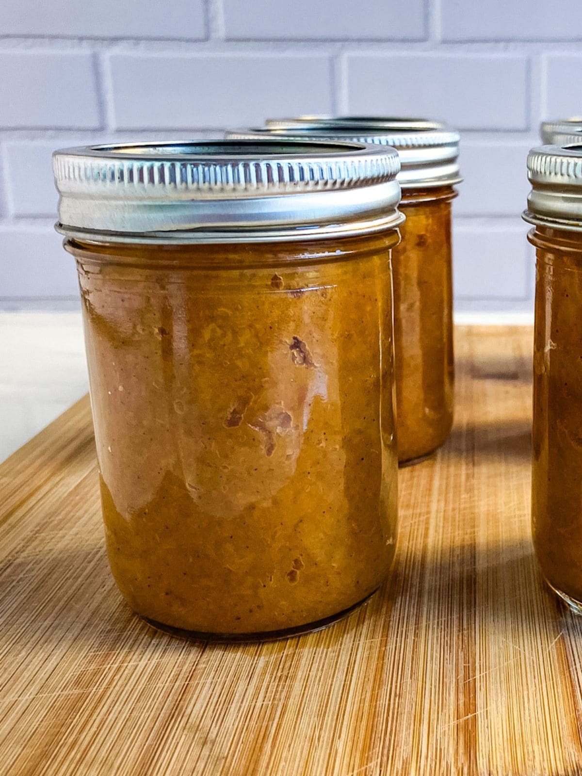 Jars of canned peach butter.
