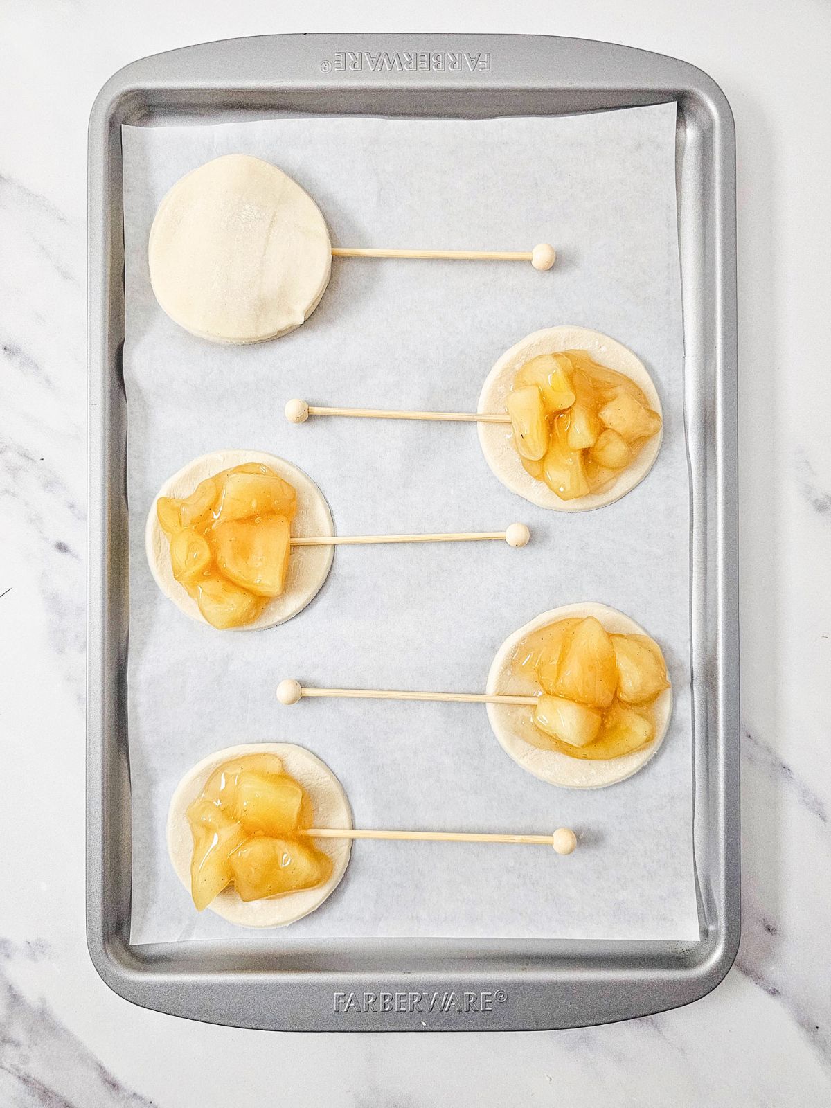 Adding the sticks and the top pie crust.