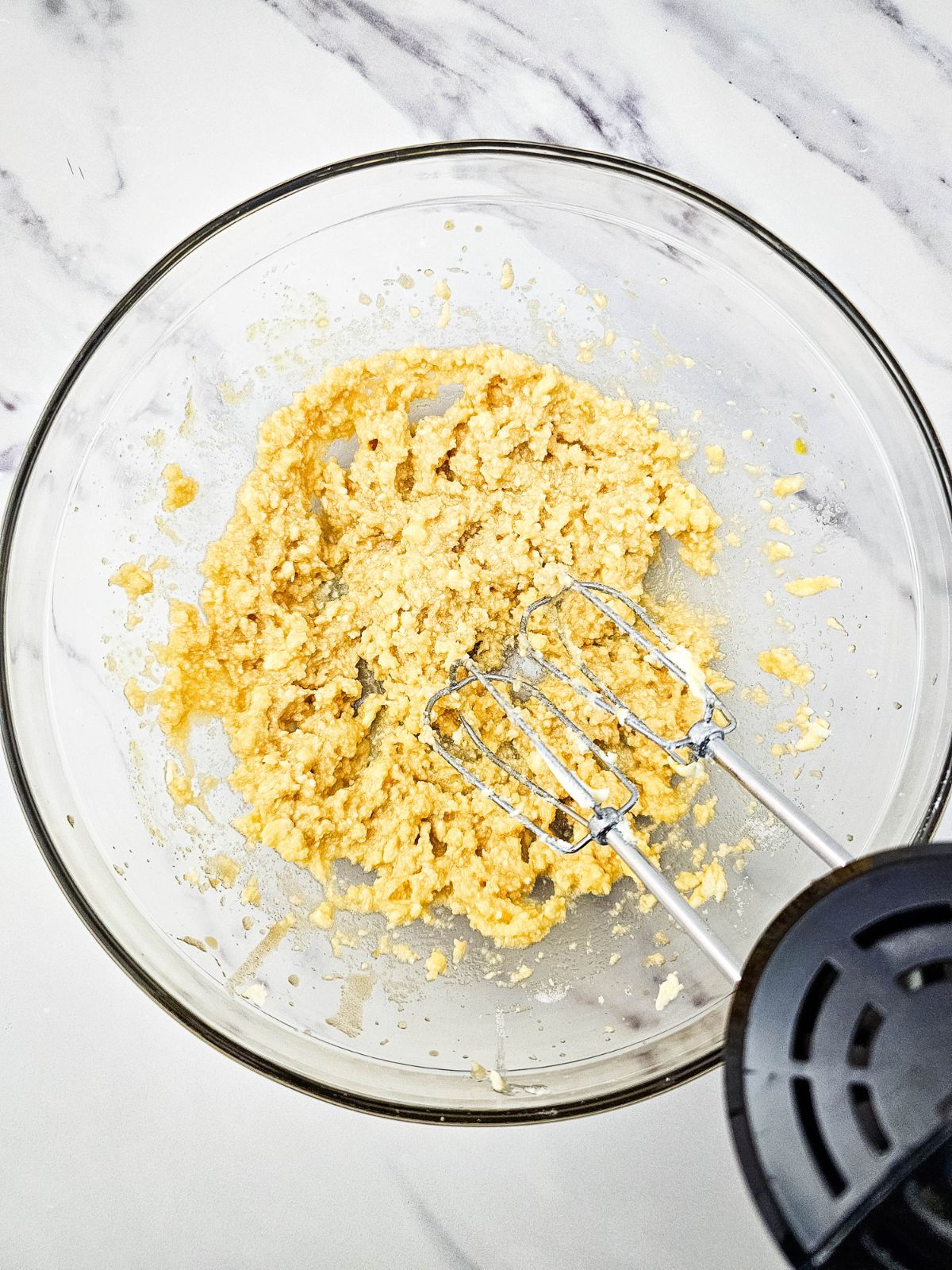 Wet cake batter ingredients are creamed together.