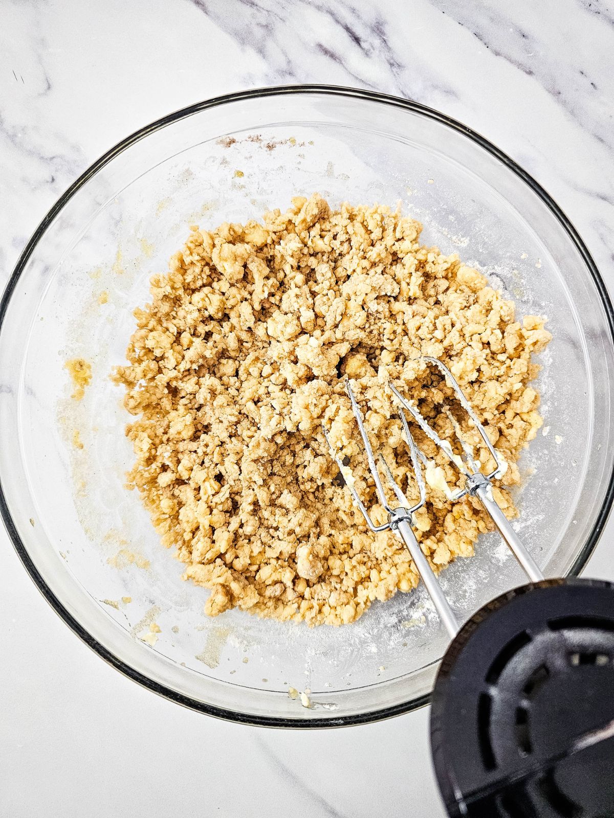Dry ingredients are mixed into the cake batter.