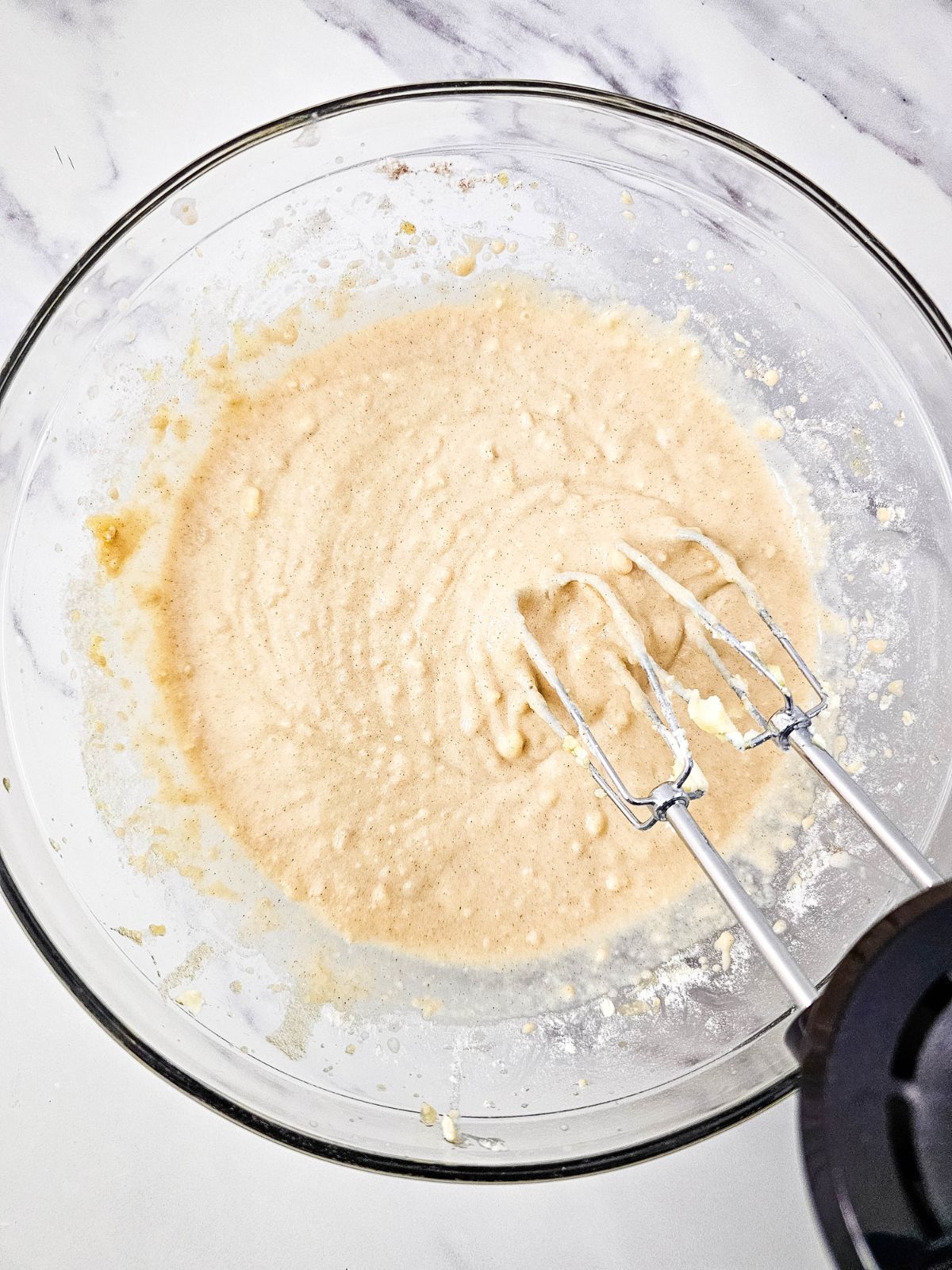 Apple crumb cake batter mixed together.