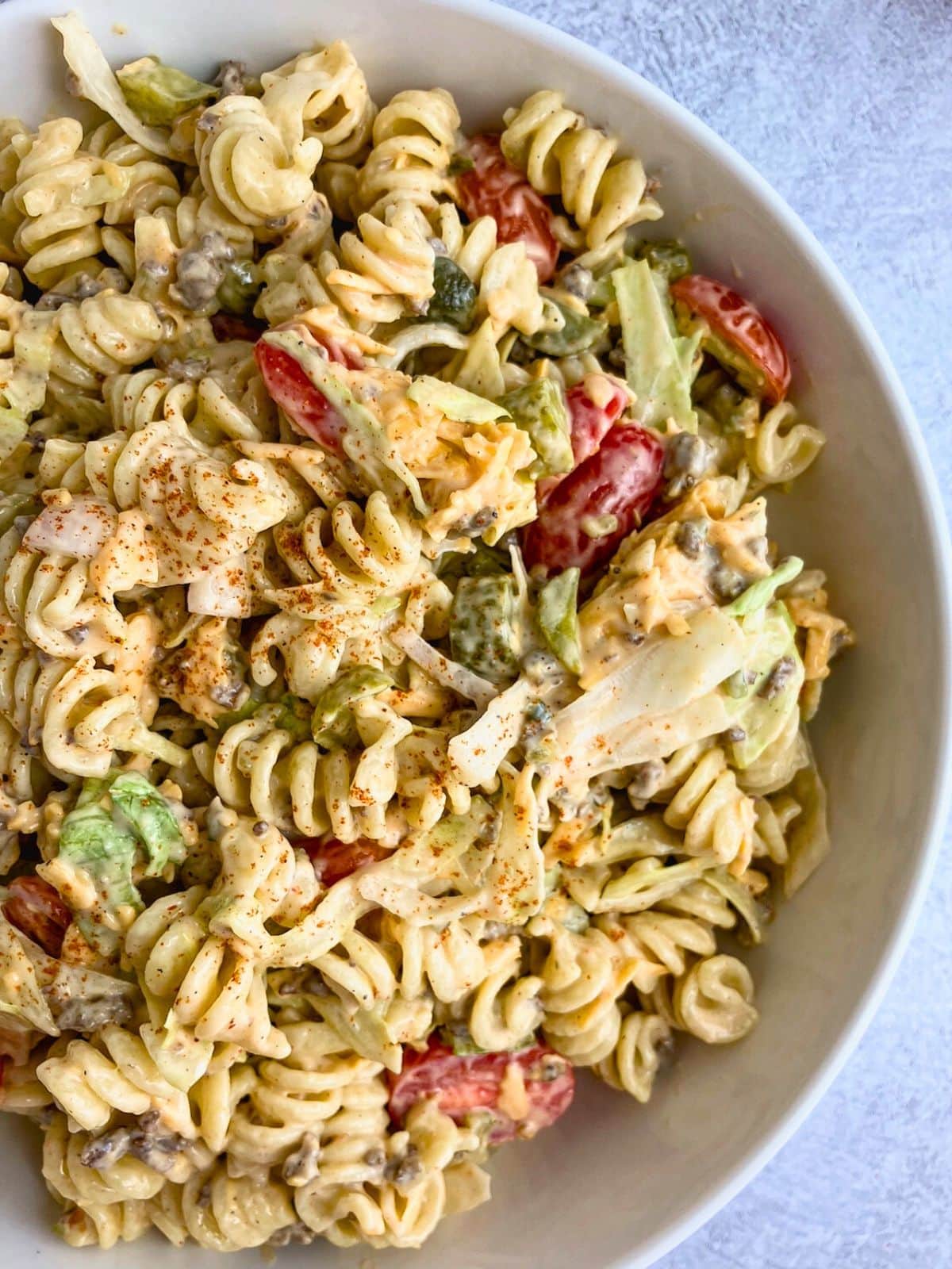 A large bowl of homemade cheeseburger pasta salad.