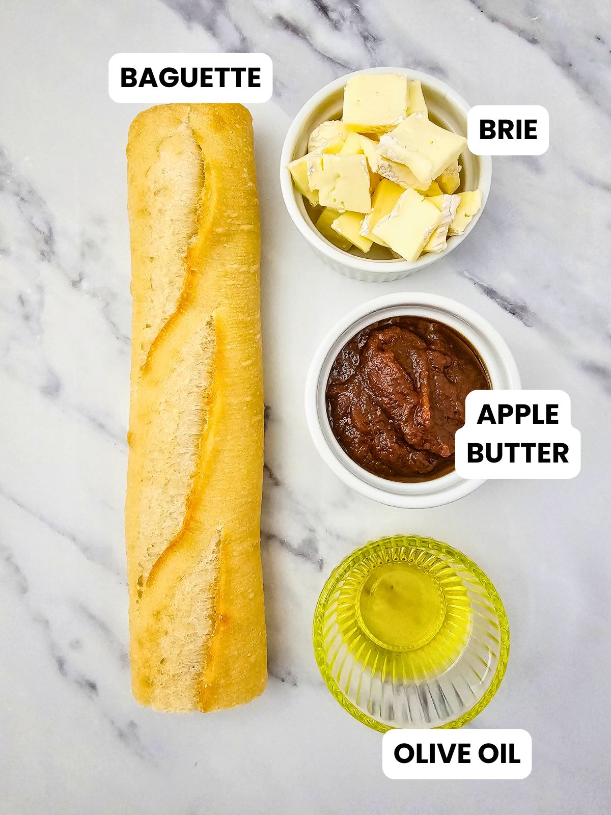 Ingredients for making brie and apple butter crostini.