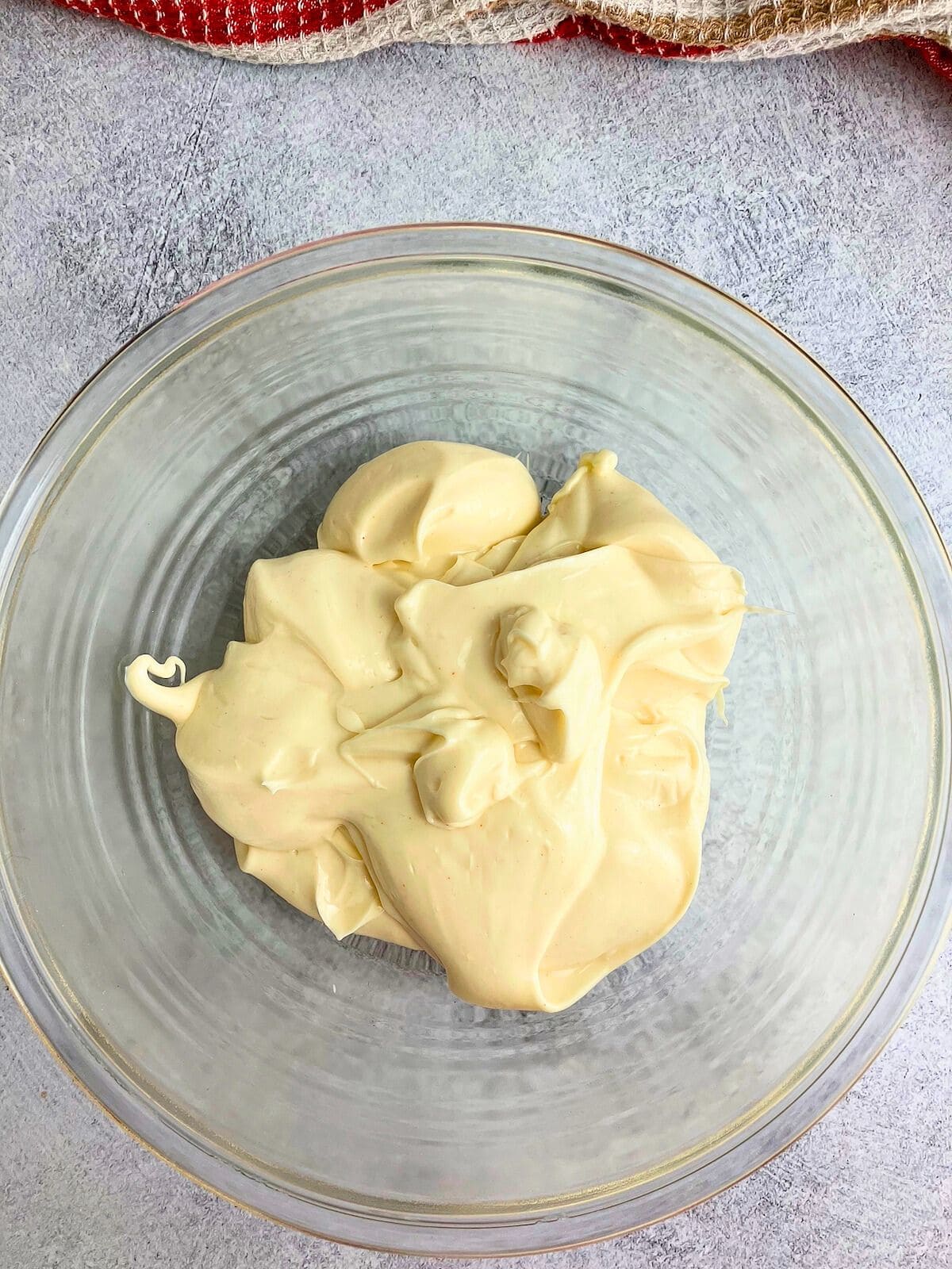 Miracle whip dressing in a mixing bowl.