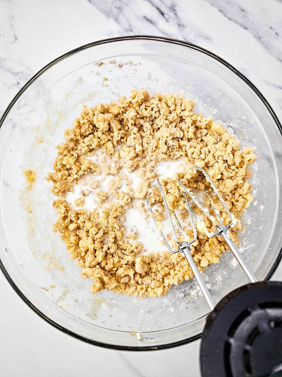 Milk was poured into the cake batter bowl.