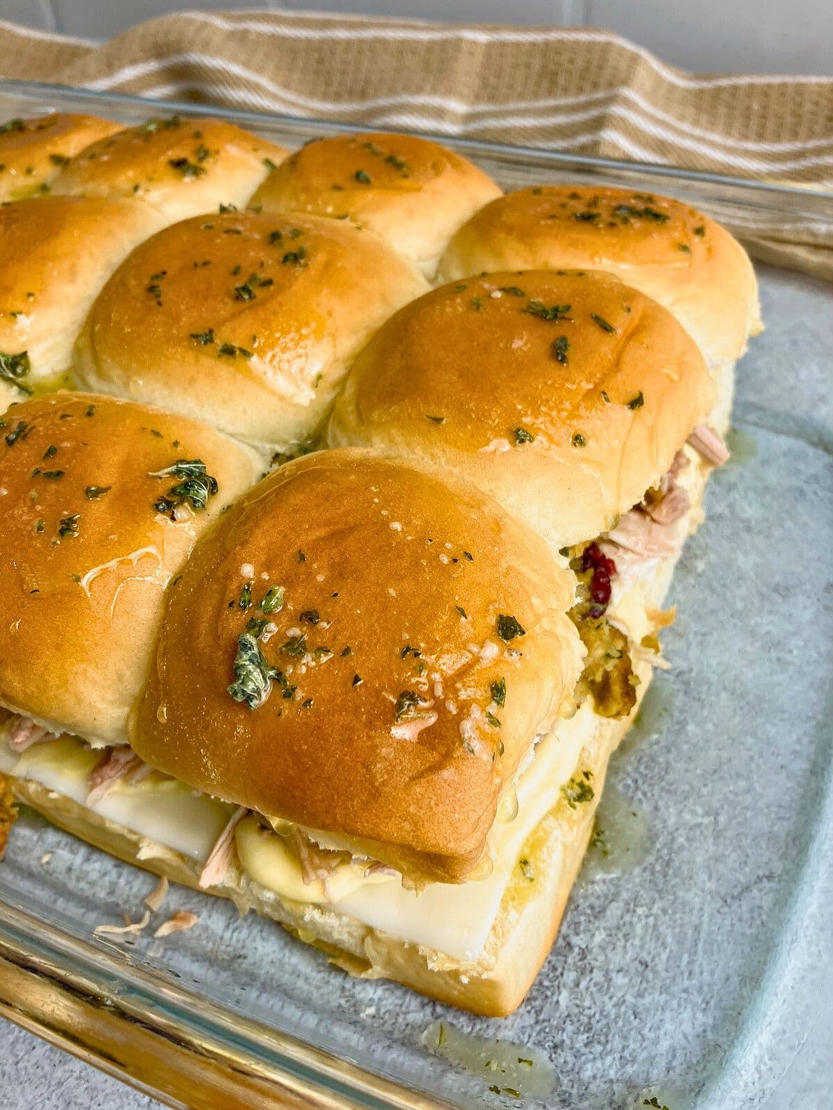 The top buns are basted with garlic butter.