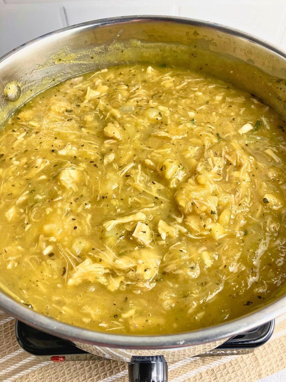 Cooked pumpkin and turkey pasta sauce.