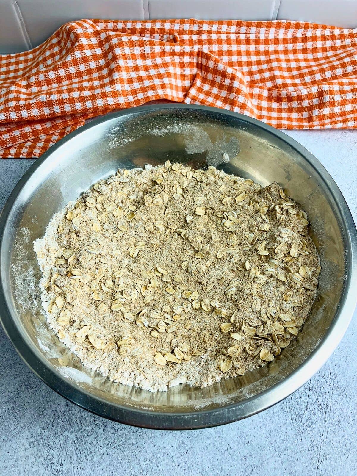 Flour, oats, cinnamon, and brown sugar mixed together for the topping.