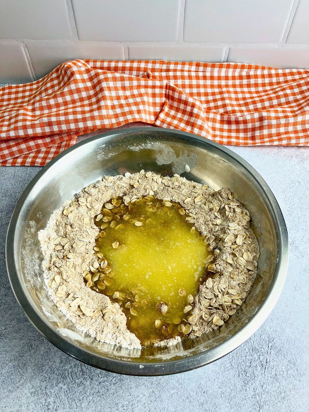 Melted butter is added to the crisp topping.