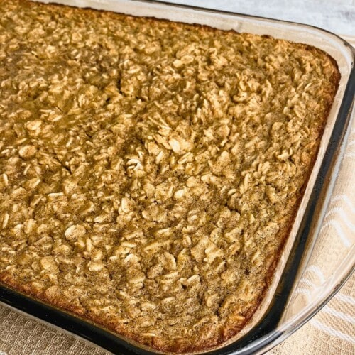 A baking dish of pumpkin baked oatmeal is cooling on the counter.