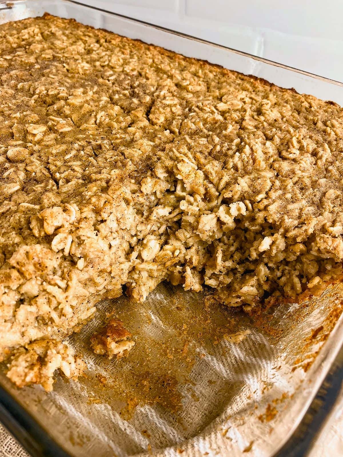 A baking dish or pumpkin oatmeal with a slice removed.