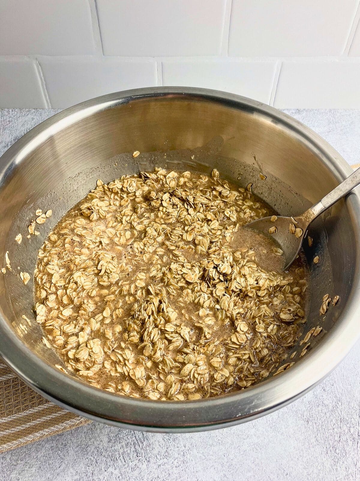 The wet and dry ingredients are mixed together in a large bowl.