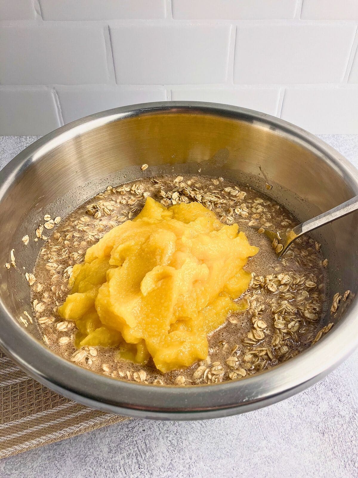 Pumpkin puree was added to the bowl of batter.