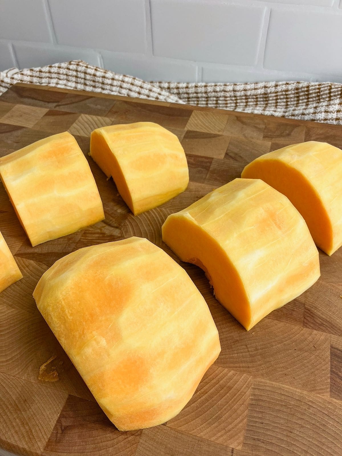 Butternut squash cut into wide chunks.