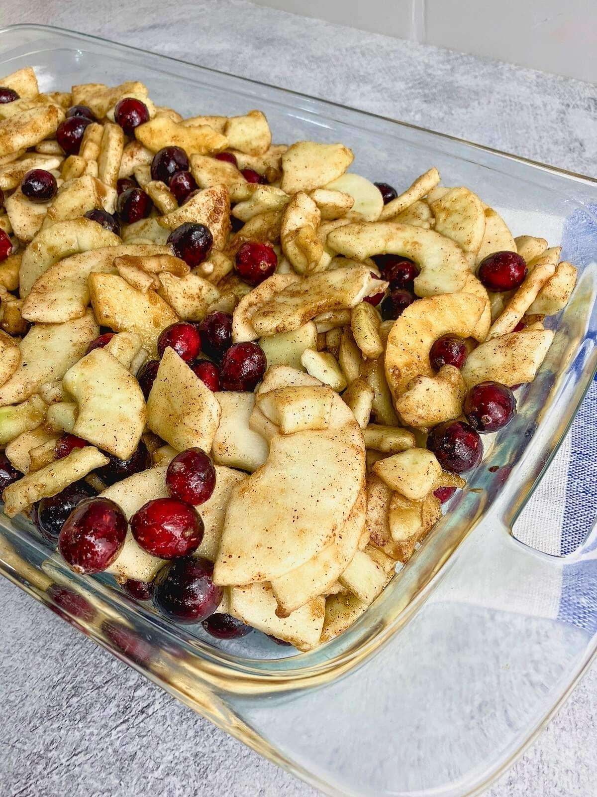 Cranberry and apple filling spread into the baking dish.