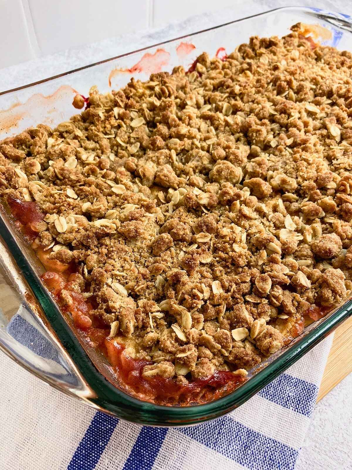 A baking dish of homemade apple cranberry pumpkin crisp.