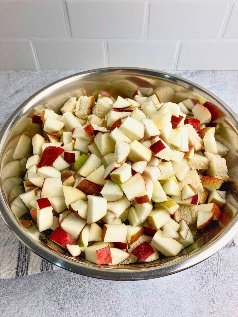 Bread cubes and diced apples were added to the egg mixture.