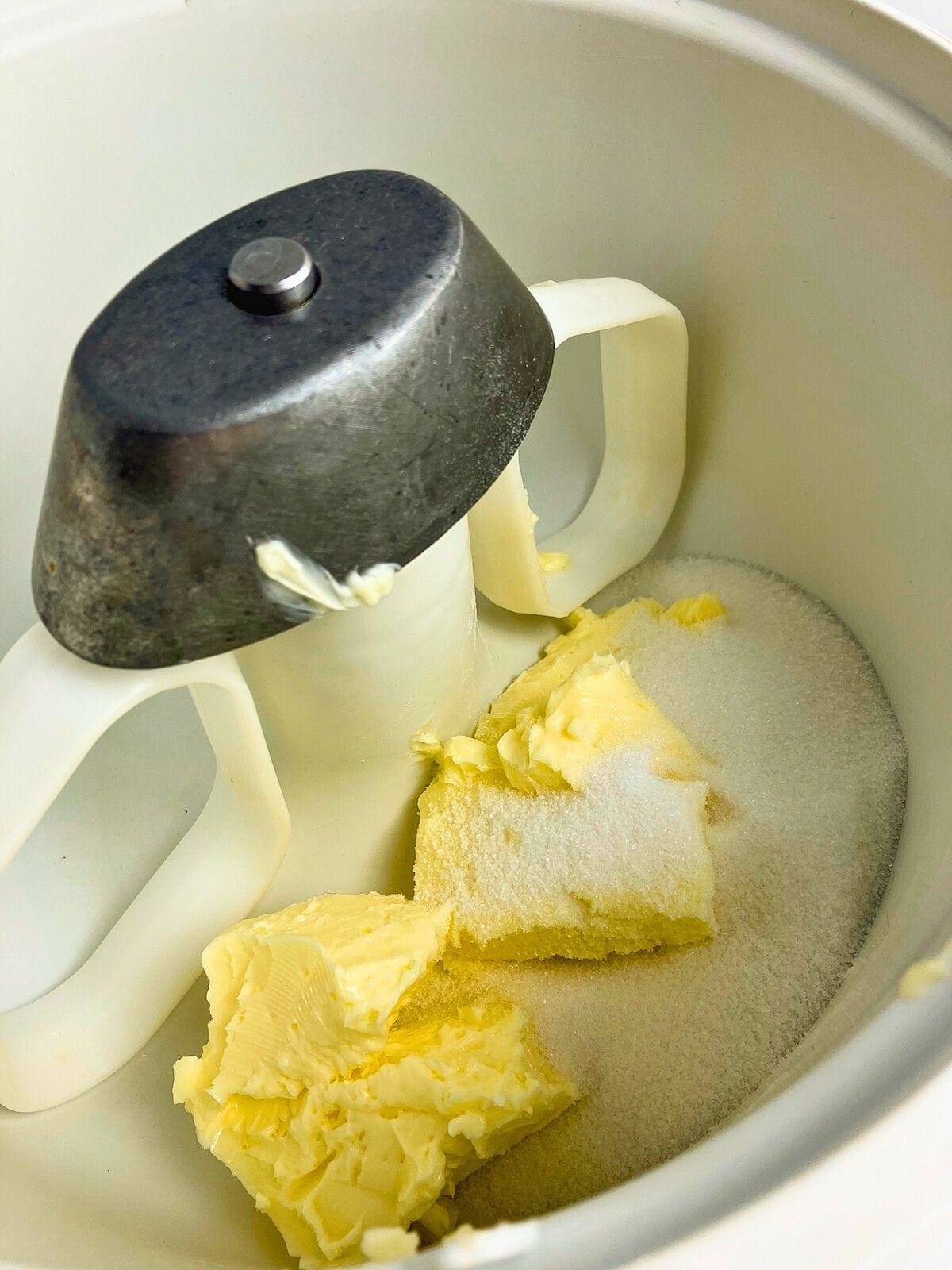 Butter and sugar in a mixer bowl.