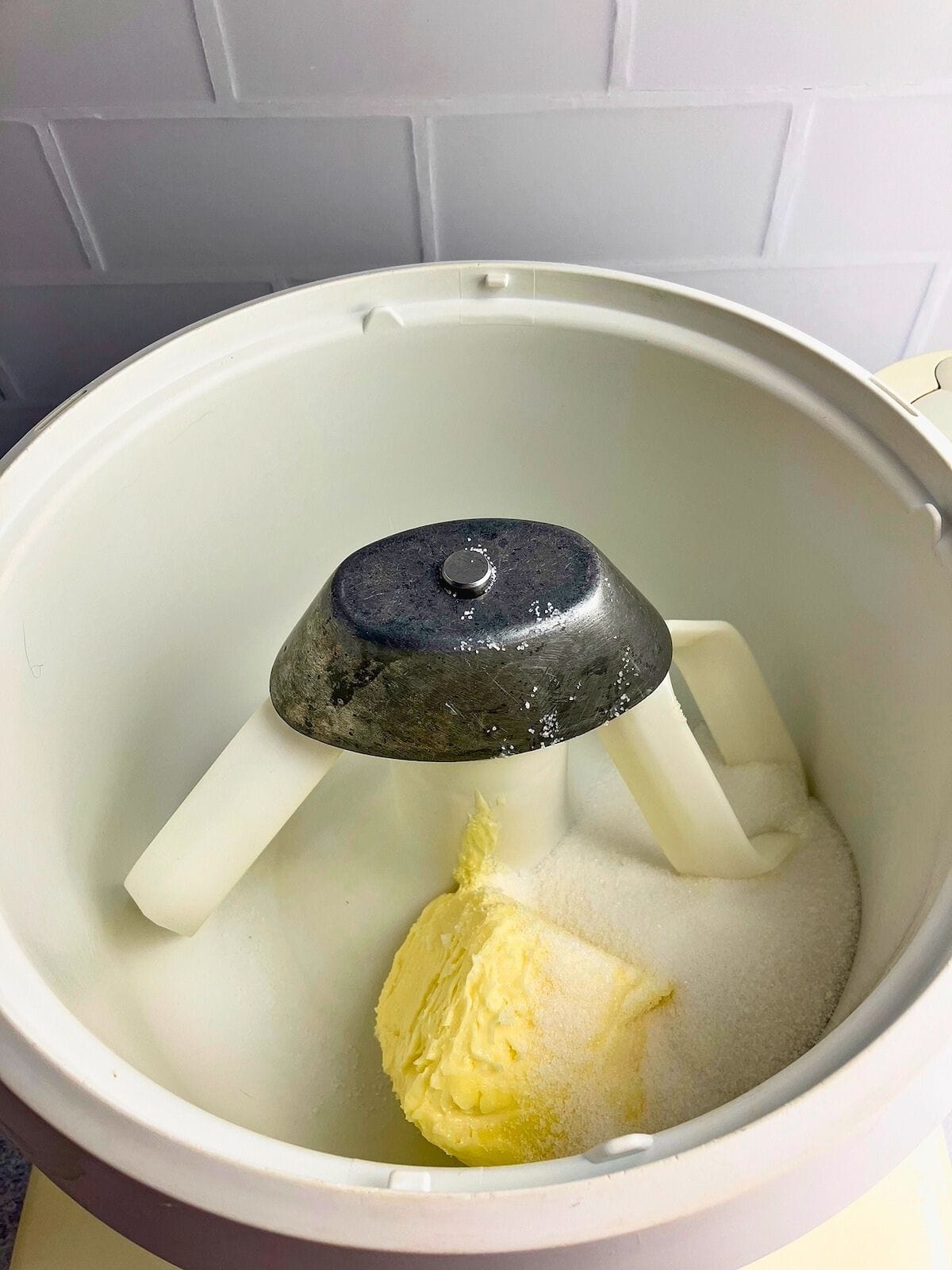 Butter and sugar in a mixer bowl.