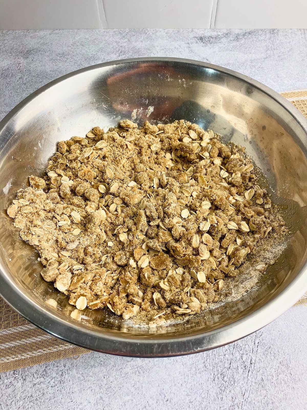 Melted butter has been mixed into the crumble topping.